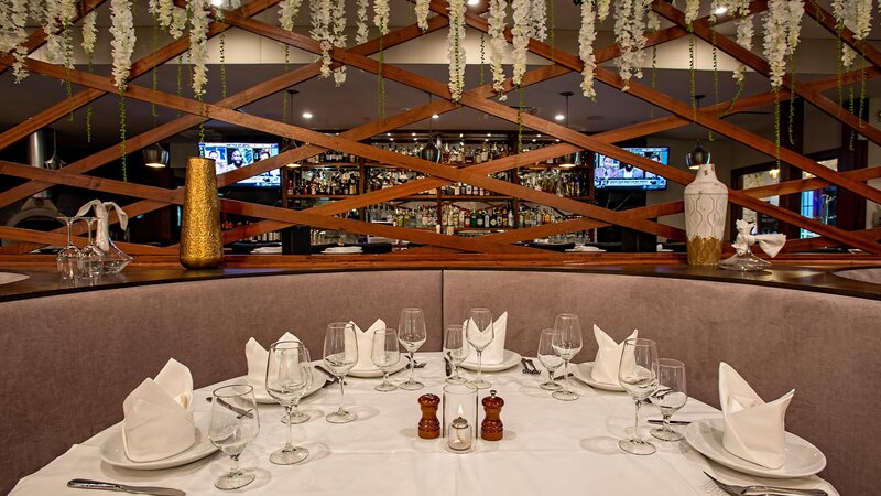 Booth seating in main dining room with seating for six